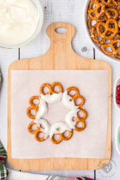 the pretzels are ready to be baked on the cutting board and decorated with icing