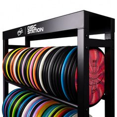 a rack with many different colored discs on it