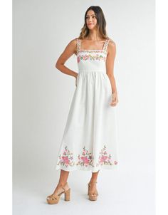 Stun in this gorgeous embroidered maxi. Features a linen blend fabric and bright floral embroidery on the bust, straps, and skirt. Maxi length Stretch smocked back Lined bust, unlined skirt Embroidered floral detailing Fabric: rayon/linen/poly SIZE GUIDE Measurements are approximate and taken while laying flat across the front. Not doubled. Small - Bust: 14”Waist: 13”Length: 50” Medium -Bust: 15”Waist: 14”Length: 50” Large - Bust: 16”Waist: 15”Length: 50” TRY-ON Varsity Sweater, Desert Flowers, Skirt Maxi, White Midi, Grad Dresses, Flower Dress, Hair Fragrance, White Midi Dress, Sweater And Shorts