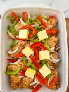 chicken and peppers with cheese in a casserole dish