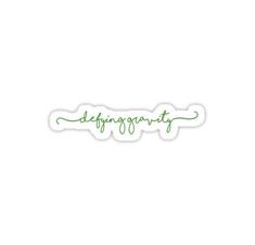 a green sticker with the word defragrt written in cursive writing