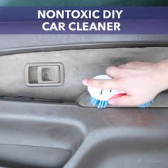 a person is cleaning the inside of a car