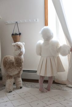 Petite Maison Kids. Ivory color genuine wool coat, fully lined. Gold button closure. Natural fur trim at shoulders and hands. Pleated back design. 100% Wool. Cape sold separately. Elegant Cream Fur Coat With Faux Fur Trim, Elegant Cream Fur Coat With Long Sleeves, Elegant Long Sleeve Cream Fur Coat, Luxury Gift Set, Blanket Shawl, Wool Cape, Girl Swag, Girls Wardrobe