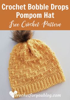 a crochet bobble hat with pompom on top and text overlay that says, free crochet pattern