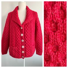 a red knitted jacket with buttons on the front and back, next to a mannequin's dummy