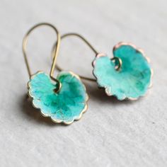 These leaf earrings are brass charms with some amazing detail, which have been carefully treated, painted and varnished to bring out beautiful tones and depth of colour and to show the incredible veining and other details of the metal.  These are coloured a beautiful, delicate and multi toned turquoise colour.  They are designed to be reminiscent of the beautiful, softly coloured lily pads found in Art Nouveau paintings. They are handmade in our Edinburgh studio and no two pairs are quite the sa Blue Artisan Copper Earrings, Artisan Blue Copper Earrings, Artisan Blue Brass Earrings, Blue Patina Earrings For Gift, Blue Brass Earrings For Pierced Ears, Gold Earrings With Patina As A Gift, Unique Blue Copper Earrings, Gold Earrings With Patina For Gift, Bohemian Blue Electroformed Earrings