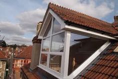 an image of a roof with windows on it