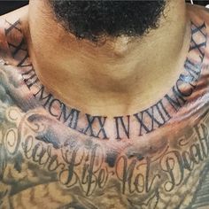 a man with tattoos on his neck and chest