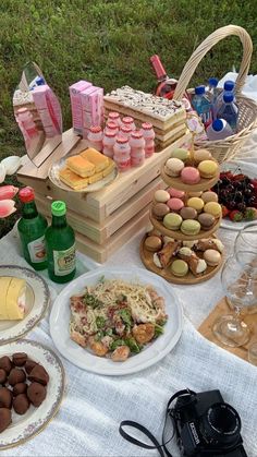 a picnic table with food and drinks on it