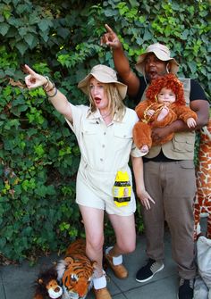 Zoo keepers and the baby lion Zoo Keepers Family Costume, Baby Lion Costume Family, Monkey Family Costume, Zoo Family Halloween Costume, Lion Family Costume, Zoo Keeper Family Costume, Safari Halloween Costume Family, Zookeeper Outfit