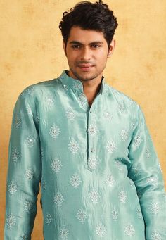 Art Upadda Silk Kurta in Sea Green. This Readymade Chinese Collar Neck and Full Sleeve attire is Enhanced with Fancy Buttons, Resham and Sequins Work Available with a Cotton Silk Aligarhi Pant in White Do note: Footwear shown in the image is for presentation purposes only. Half to one inch may vary in measurement. (Slight variation in actual color vs. image is possible) We sell all kinds of menswear. Mens Kurta | Mens Kurta Pajama | Mens Sherwani | Mens Sherwani Sets | Traditional Menswear | Par Embroidered Churidar For Reception, Transitional Resham Embroidery Kurta For Reception, Embroidered Churidar For Reception And Transitional Season, Transitional Embroidered Churidar For Reception, Festive Pista Green Chanderi Bandhgala, Traditional Wear With Chikankari Embroidery For Festivals And Receptions, Chikankari Embroidery Traditional Wear For Festivals And Reception, Chikankari Embroidered Traditional Wear For Reception And Festivals, Pista Green Embroidered Kurta For Diwali