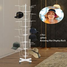 a hat rack with hats hanging from it's sides and a photo of a woman in the background