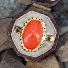 This vibrant vintage 18k yellow gold ring features a bezel set natural oval coral cabochon with a pierced oval bezel border. The ring is currently size 7. Classic Oval Hallmarked Enamel Ring, Classic Oval Enamel Ring For Gift, Oval 14k Gold Enamel Ring For Formal Occasions, 14k Gold Oval Enamel Ring For Formal Occasions, Formal Oval Enamel Ring In 14k Gold, Formal Oval 14k Gold Enamel Ring, Vintage Oval Coral Jewelry, Elegant Oval Coral Rings, Vintage Coral Oval Jewelry