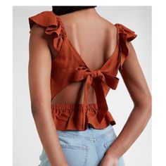 This Breezy Linen-Blend Top Features Flirty Ruffles, A Cutout Back And A Peplum Hem. Color: Copper Features & Fabric Square Neck Sleeveless; Ruffle Straps Cutout Back With With Tie Elastic Back Waistband; Peplum Hem Hits At Waistband Linen/Rayon Fitted Blouse With Ruffled Straps For Day Out, Summer Date Night Blouse With Ruffles, Trendy Ruffled Tops For Date Night, Ruffled Cropped Blouse For Beach, Cropped Ruffle Blouse For Beach, Cropped Ruffled Blouse For The Beach, Cropped Ruffle Blouse For The Beach, Summer Date Night Top With Ruffle Hem, Summer Ruffle Hem Top For Date Night