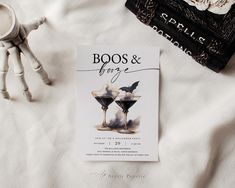 the book boos and fire is sitting on top of a bed next to a pair of scissors