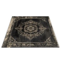 a black and white rug with an ornate design on the bottom, in front of a white background