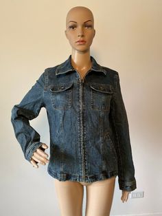 Jones New York Signature Blue Denim Jean Jacket  This coat is in excellent condition with no flaws to note. The denim is made of cotton and spandex, giving it a bit of stretch. This features a zipper front closure, a single button at each cuff, two slant side pockets, and two buttoned breast pockets. This jacket is machine washable. This jacket is marked a size M, but please check the measurements below as sizing varies from maker to maker. Lying flat, it measures 15-1/2 inches from shoulde Medium Wash Denim Jacket With Zipper, Denim Blue Long Sleeve Denim Jacket, Medium Wash Denim Outerwear With Zipper, Denim Blue Long Sleeve Jacket With Zip Fly, Denim Blue Outerwear With Zipper Closure, Denim Blue Jacket With Zipper Closure, Blue Urban Denim Jacket With Button Closure, Cheap Button-up Denim Jacket With Button Closure, Pre-washed Denim Blue Cotton Outerwear