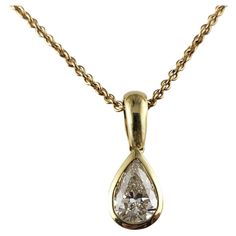 Vintage 14 Karat Yellow Gold Diamond Solitaire Necklace JAGi Certified- This lovely pendant necklace features one pear shaped diamond set in classic 14K yellow gold. Diamond weight: .92 ct. Diamond color: H Diamond clarity: VS2 Size: 22.5 inches (necklace) 18 mm x 7 mm (pendant) Weight: 7.5 gr./ 4.8 dwt. JAGi Certificate included. Very good condition, professionally polished. Will come packaged in a gift box or pouch (when possible) and will be shipped U.S. Priority Mail Insured. DV042423/17KCS Classic Yellow Gold Solitaire Teardrop Pendant Necklace, Classic Yellow Gold Drop Solitaire Necklace, Classic Yellow Gold Solitaire Teardrop Necklace, Classic Drop Solitaire Necklace In Yellow Gold, Classic Single Diamond Pear-shaped Necklace, Classic Yellow Gold Pear Shaped Diamond Necklace, Yellow Gold Pear-shaped Diamond Solitaire Necklace, Formal Single Diamond Pear-shaped Necklace, Classic Pear-shaped Diamond Necklace With Single Diamond