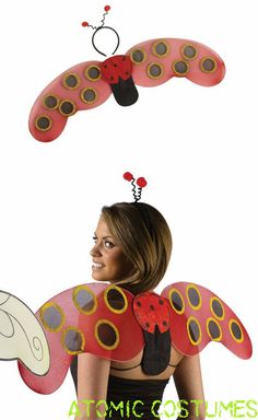 a woman wearing a lady bug costume with two wings