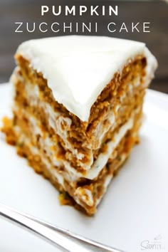 a close up of a piece of cake on a plate with the words pumpkin zucchini cake