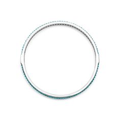 Turquoise gemstones set with smoothly polished sterling silver forms this round bangle detailing the LAGOS logo. Turquoise Gemstone Sterling Silver Bracelet, Round Turquoise Sterling Silver Bangle, Modern Round Turquoise Jewelry, Modern Turquoise Round Jewelry, Gemstone Bangle, Engraved Items, Gemstone Bracelets, Turquoise Gemstone, Designer Jewelry