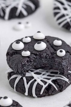 a chocolate cookie with white frosting and spooky eyes