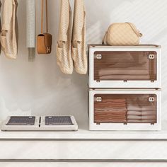 two suitcases sitting on top of a white counter