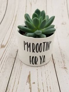 a potted plant with the words i'm rootin for ya on it