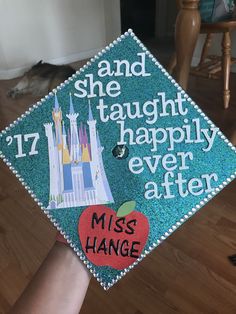 a blue graduation cap with the words and she taught happily ever after, miss hange