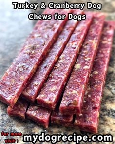 raw dog chews for sale on a granite counter top with text overlay that reads turkey and cranberry dog chews for dogs