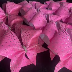 "Neon pink glitter waterfall rhinestone cheer bows are stunning!  They are a great competition bow, sideline cheer bow, or all star cheer bow and take any uniform to the next level. We use only the highest quality of rhinestones for maximum shine and twinkle.  They measure 7\"x6\" and are attached to a thick nylon hair tie. There are over 20 colors to choose from.  Checkout my other listing to see this bow in even more colors.   https://www.etsy.com/BOWSandBALLERS/listing/1348160528/rhinestone-cheer-team-bow-in-lots-of?utm_source=Copy&utm_medium=ListingManager&utm_campaign=Share&utm_term=so.lmsm&share_time=1672416588933 ----SHIPPING & PROCESSING--- ♥ Processing Time (the time it takes me to create your order) Pleas refer to my shop announcements and FAQ's for up to date processing time inf Pink Cheer Bow, All Star Cheer Uniforms, Pink Cheer Bows, Competition Cheer, Competition Bows, Sideline Cheer, Cheerleading Bow, Cheer Team Gifts, Cheerleading Bows