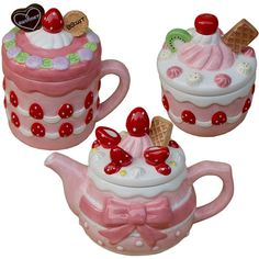 three ceramic teapots with designs on them and one has an ice cream sundae