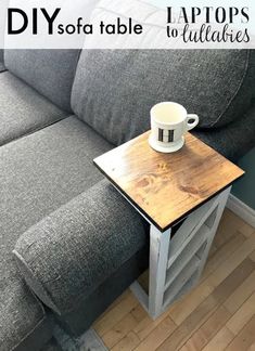 a table with a cup on it sitting in front of a couch that has the words diy sofa table