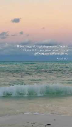 an ocean with waves and a bible verse on the beach at sunset or sunrise time