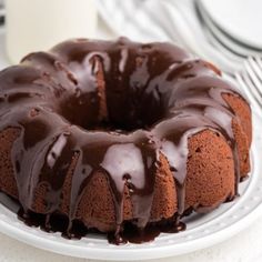 a bundt cake with chocolate icing on a plate