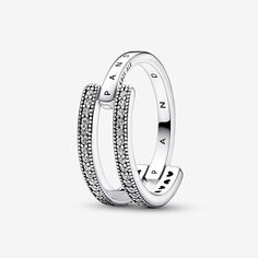 Take your signature stack to the next level with the Pandora Signature Logo & Pavé Double Band Ring. The unique shape of this sterling silver ring makes it a stand-out piece; one half features two parallel bands with rows of sparkle framed by microbeading, the second half is a single band that connects the double shape, creating a sculptural contrast. Perfect on its own or layered, it's the jewelry collection essential you'll reach for over and over. Pandora Signature Logo & Pavé Double Band Rin Pandora Logo, Double Band Ring, Double Band Rings, Pandora Rings, One Half, Jewelry Essentials, Thomas Sabo, Ring Size Guide, Signature Logo