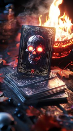 a deck of cards sitting on top of a table next to a lit candle and fire