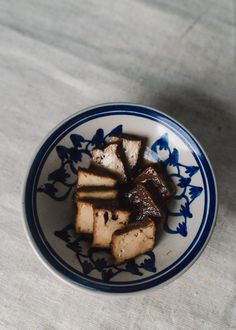 a bowl with some food in it on a table