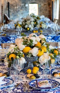 the table is set with blue and white plates