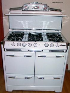 an old fashioned white stove with two burners