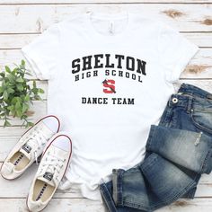 Shelton High School Dance Team Shirt If you’re the school spirit type, this Shelton High School Dance Team Shirt is for you! Get ready to show your SHS pride with this comfortable and stylish shirt, perfect for cheering on your favorite dance squad. Go Climbers!! Choose T-shirt, Crewneck Sweatshirt or Hoodie Sweatshirt. Super comfy unisex sizes. Our shirts, hoodies, and sweatshirts are crafted with comfort and quality in mind. Made from premium materials, they are soft, durable, and perfect for High School Dance Team Shirts, Dance Team Clothes, High School Dance Team, School Dance Team, Team Mom Shirt, Dance Squad, Dance Team Shirts, Hubby Wifey Shirts, Team Spirit Shirts