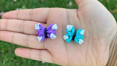 two small pieces of colorful hair clips in someone's hand