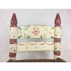 a white chair with flowers painted on it