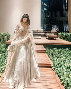 Poses In Lehangas Aesthetic, Glass Tissue Lehenga, Lahenga Aesthetics, Indian Lehenga Aesthetic, Poses On Lehenga, Pose In Lehenga, Lengha Poses, Crop Top Lehenga Wedding, Poses In Lehenga