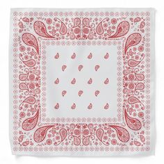 a red and white bandanna with paisley designs on it's edges, in front of a white background