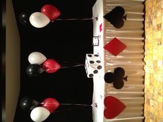 a table topped with cards and balloons