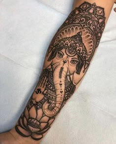 an elephant tattoo is shown on the arm