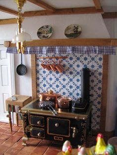 an old fashioned stove with pots and pans on it