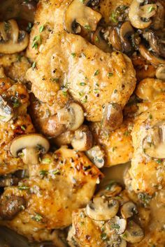 chicken thighs with mushrooms and herbs in a skillet