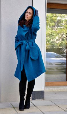 "Hooded Wool Coat, Winter Wool Coat, Dark Blue Coat Turquoise coat. Autumn-winter loose coat. Wool hooded maxi coat. Oversize wool jacket. Handmade item. The coat has a viscose lining. Two pockets, warm hood. Black 100% wool, best quality wool coat . Casual and warm, cozy and very comfortable . You can wear it in winter in warmer days, and in autumn and winter. Model wearing size : SIZE S Color : Turquoise SIZE S (US 6, UK 10, Italian 40, French 38, German 36, Japan 7) bust: fits bust around 35. Blue Wool Coat With Pockets For Fall, Oversized Blue Hooded Jacket With Pockets, Blue Oversized Hooded Outerwear, Oversized Long Blue Outerwear, Blue Shawl Collar Outerwear For Fall, Blue Winter Sweater Coat With Pockets, Oversized Winter Coat, Dark Blue Coat, Black Hooded Coat